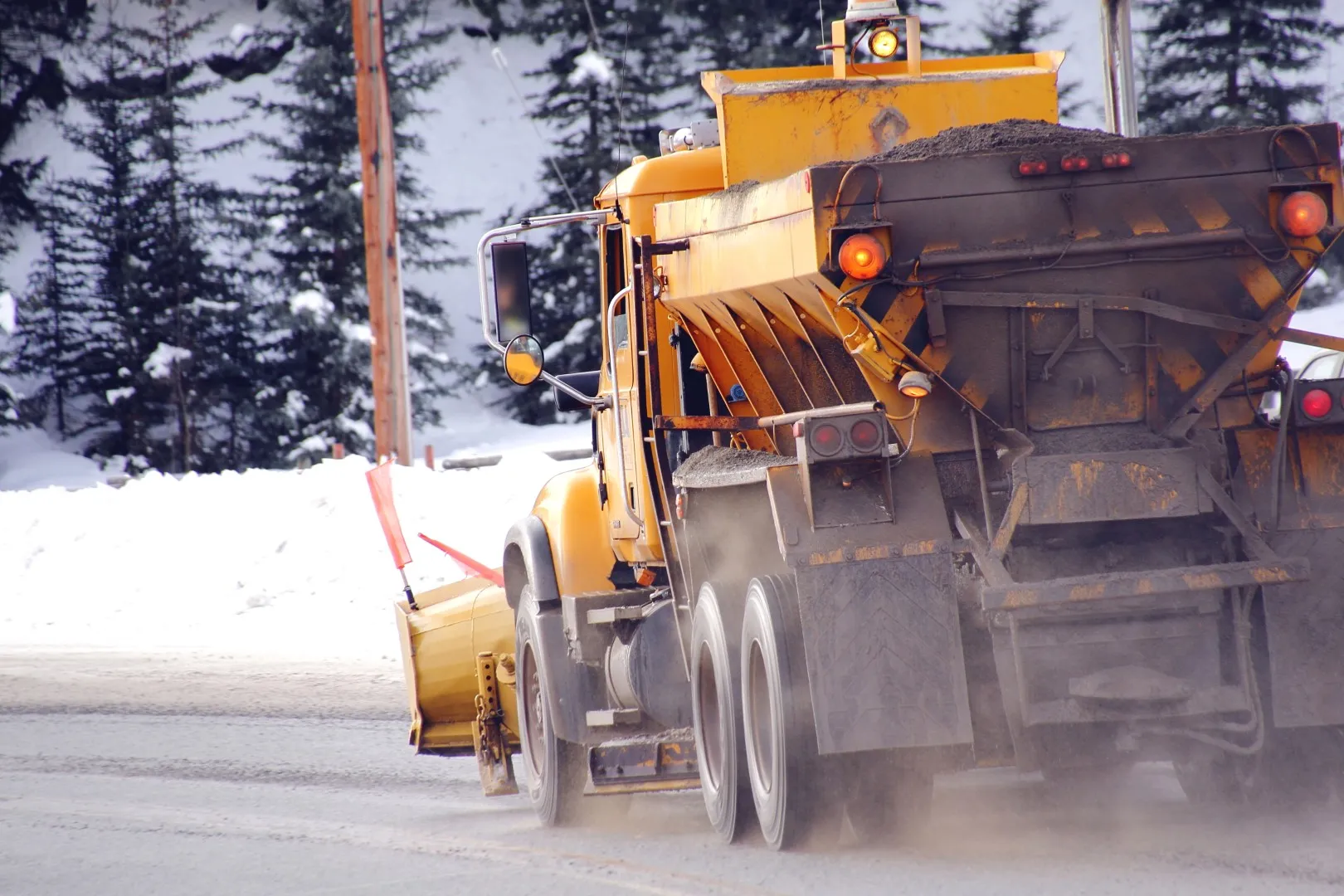 City truck applying salt
