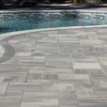 Concrete paver installation around Londonderry pool