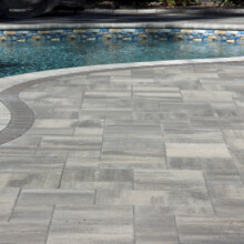 Concrete paver installation around Londonderry pool