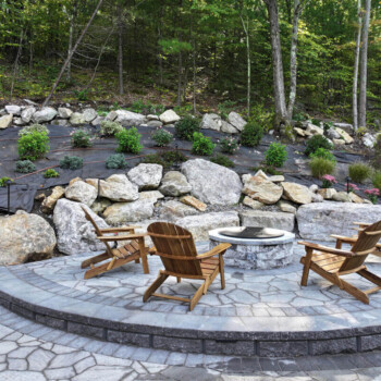 Paver patio and fire pit hardscape design by Groundhog Landscaping in Derry, NH.