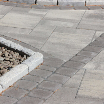 Paver patio and walkway design inspiration by Groundhog Landscaping in Derry, NH.