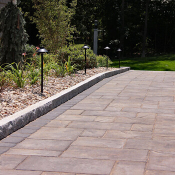 Paver patio and walkway design inspiration by Groundhog Landscaping in Derry, NH.