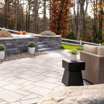 Paver patio and walkway hardscape design by Groundhog Landscaping in Derry, NH.